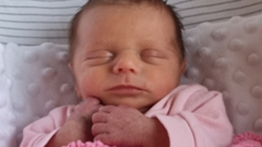 A courtroom scene related to the infant death abuse case, showing legal proceedings.