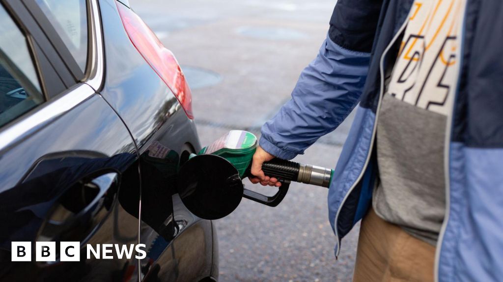 Business professionals discussing oil prices surge in a conference room.