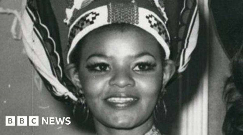 Cynthia Shange Miss World contestant in elegant conservative attire at event.