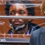 A serious courtroom scene involving D4vd child abuse images case.