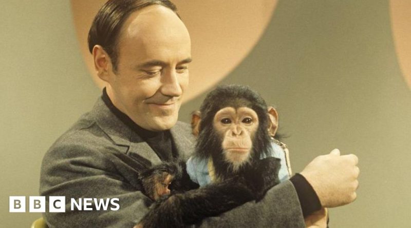 Diverse professionals discussing human behavior in a conference room.