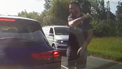 A road rage incident captured by a dashcam shows a serious driver.