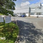 Employees discussing the DS Smith closure proposal in a serious office meeting.