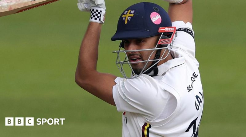 Durham cricket victory scene with players batting during a match.