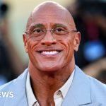 A vibrant wrestling musical performance showcasing the energy of stage adaptations.