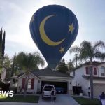 A hot air balloon emergency landing in a backyard in California.