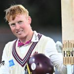 James Rew practicing cricket with teammates during training session.