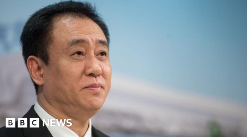 Business professionals discussing the Evergrande fraud case in a modern office.