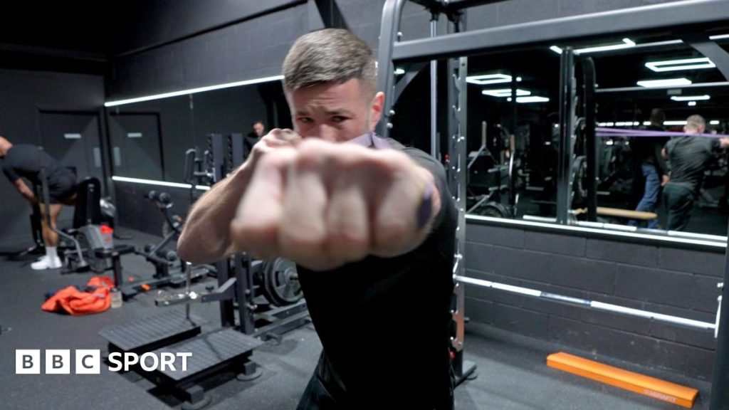Fighters in a gym practicing bare-knuckle boxing safety techniques.
