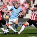 A diverse group discussing FA Cup prediction in a modern office.