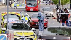 A mother waits outside a hospital, hoping for her son's recovery after the Golders Green stabbing incident.