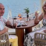 A group in professional attire discussing asbestos-related cancer case.