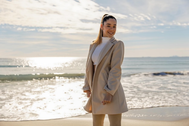 A lively beach scene featuring Jordan Bardella romance rumors with professional attire.