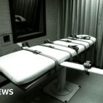 Professionals discussing federal executions methods in a serious legal setting.