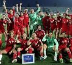 Afghan women footballers celebrating their return to international sports.