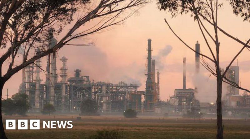 Firefighters battling a large fire at an Australian oil refinery.