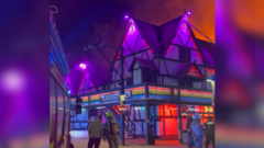 LGBT+ club fire evacuation scene with emergency responders present.