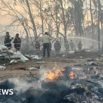 Emergency responders at a fireworks explosion scene in India.