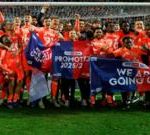 Exciting football match in the UK illustrating promotions and relegations.