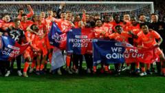 Exciting football match in the UK illustrating promotions and relegations.