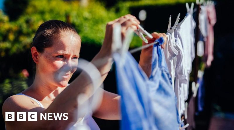 Diverse professionals happily doing laundry, illustrating free electricity for washing clothes during sunny weekends.