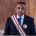 Professionals in a serious discussion about the Madagascar unrest plot.