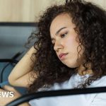 A group of professionals discussing friendly AI chatbots accuracy in a modern office setting.