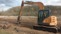 Professionals engaging in wetland conservation funding efforts for biodiversity.