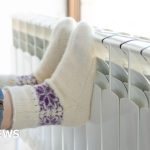 A business meeting discussing energy prices drop among professionals in conservative attire.