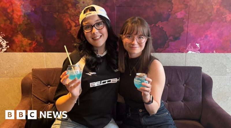 A group of young adults enjoying Gen Z cocktails in a lively bar setting.