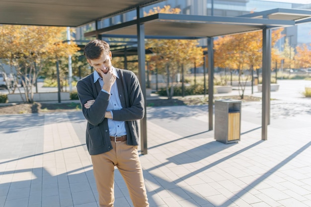 Scene depicting affordable transport in Wales with diverse people at a bus stop.