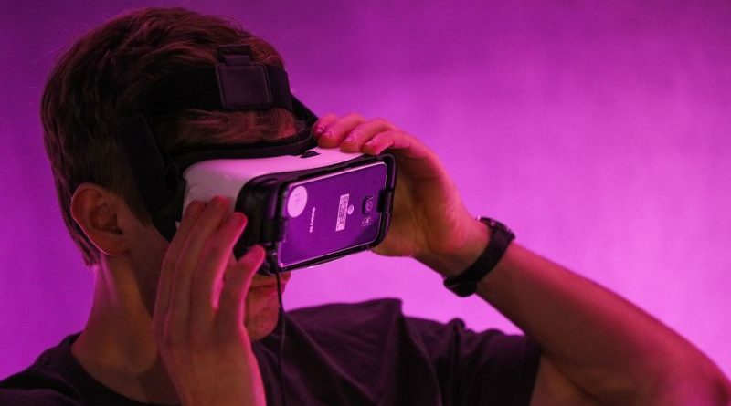 A family exploring VR gear for kids in a cozy living room.