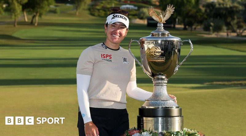 Hannah Green golf victory at a tournament with a beautiful course background.