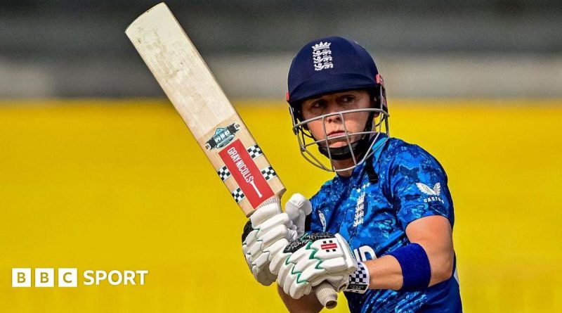 A group of women cricketers showcasing teamwork during a match, focused on the T20 World Cup legacy.