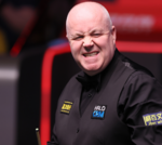 John Higgins and Shaun Murphy compete in a tense semi-final snooker match.