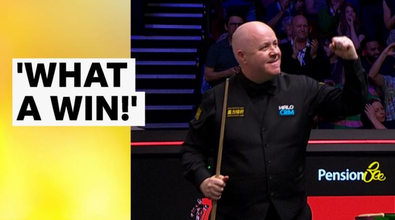 John Higgins and Ronnie O'Sullivan in a tense snooker match.