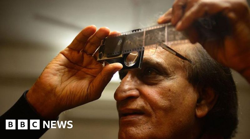 Photographers in formal attire capturing moments, showcasing Raghu Rai photography's impact.