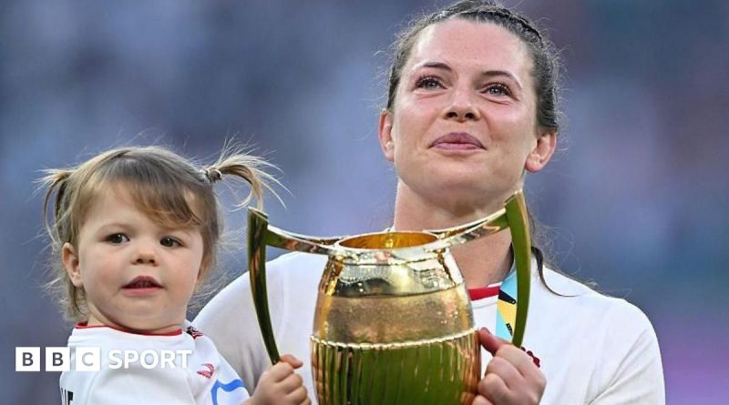 Women in rugby celebrating motherhood in sports, showing teamwork and joy.