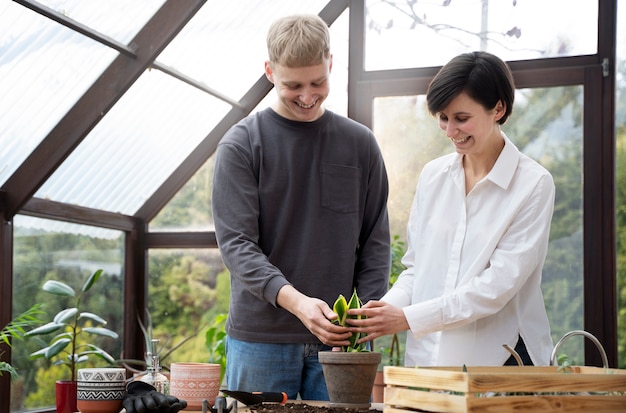 A professional group discussing human composting in a green setting.