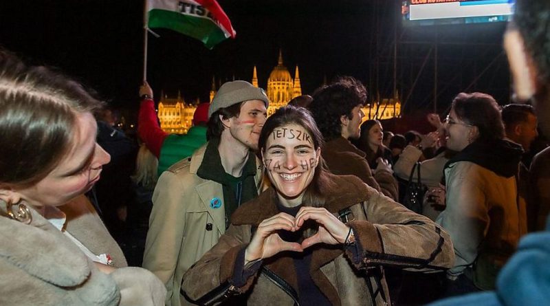 Voters celebrating in Hungary, representing the hope of new leadership.