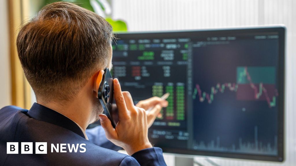 Professionals discussing the impact of falling share prices on finances.