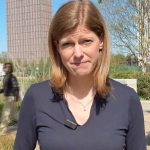 Group of professionals discussing rising prices impact during a financial meeting.