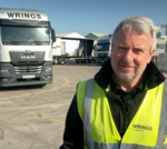 Professionals discussing the impact of rising oil prices on transport costs.