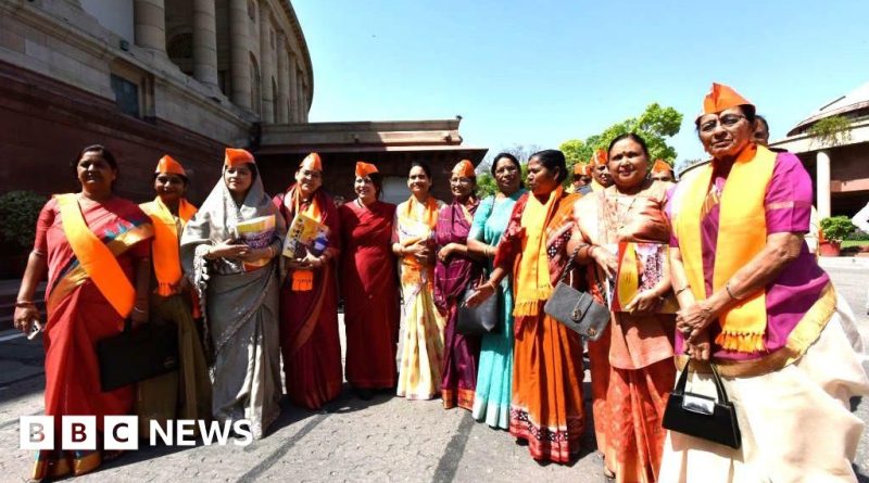 Women discussing the women's quota bill in a parliamentary setting.