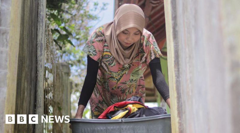 Group of domestic workers discussing their rights in a professional setting.