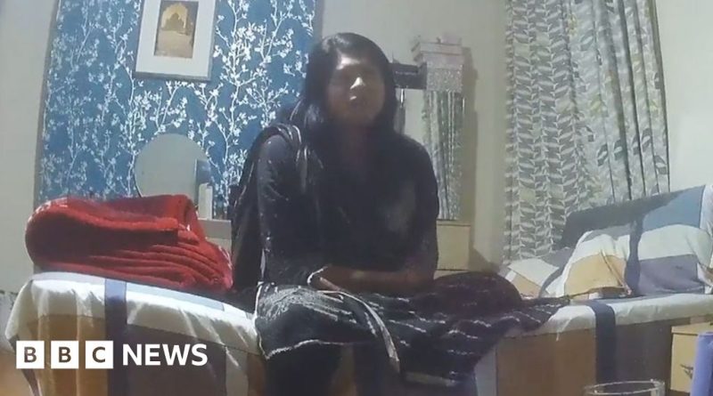 Professionals discussing fraudulent asylum claims with migrants.