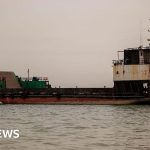 Diplomats discussing the Strait of Hormuz ceasefire in a formal meeting.