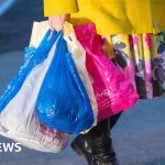 Group of professionals discussing the island inflation rate in a meeting.