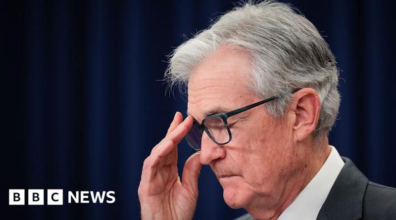 A diverse group of professionals discussing economic issues at a conference, highlighting Jerome Powell press conference.