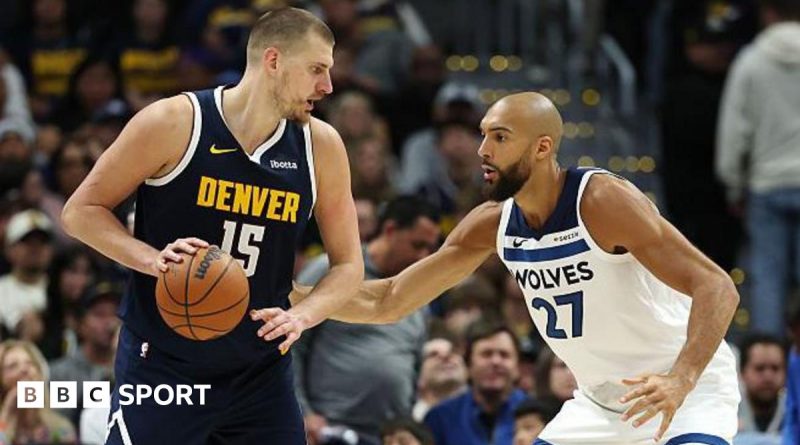 Nuggets playoff hopes highlighted by basketball action scene.
